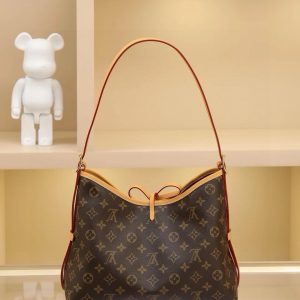 Alternative view of CarryAll Medium Handbag, crafted from Monogram canvas with leather trim for a form-fitting silhouette. Generous interior space includes a zippered pocket, while a detachable zippered clutch adds functional versatility. Buckle-adjustable handle length. Dimensions: 39×30×15cm